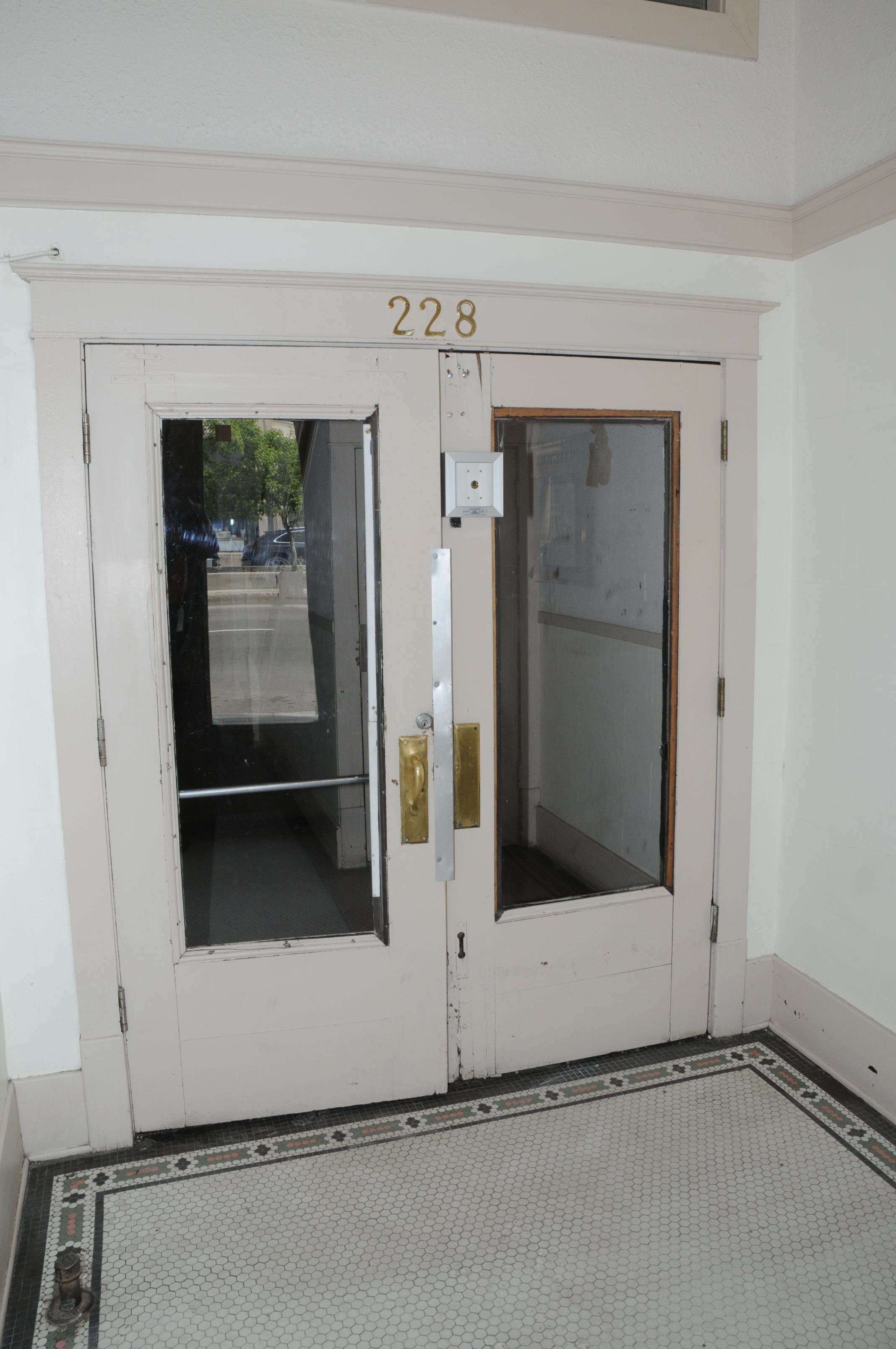Image of the Traveler's Block lobby door.